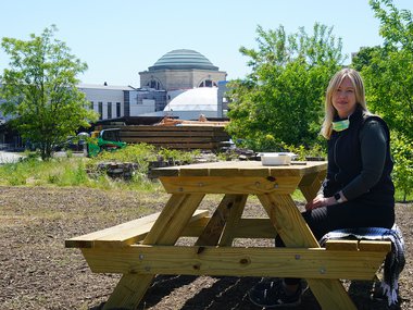 female sitting at a picnic table.jpg