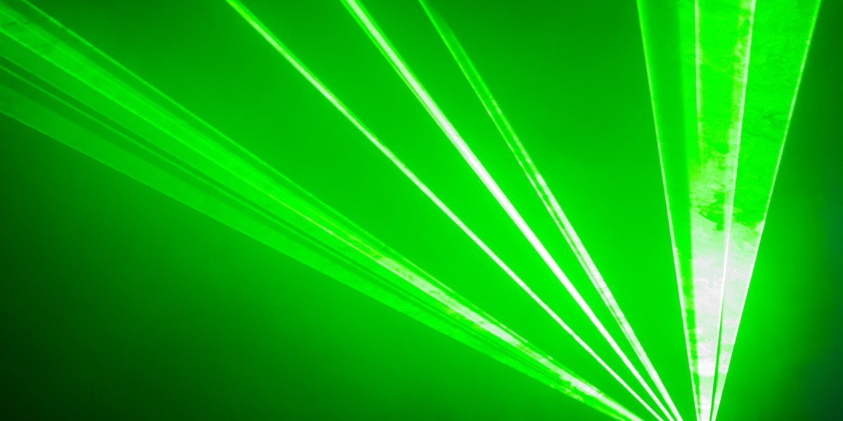 Abstract image of green laser beams