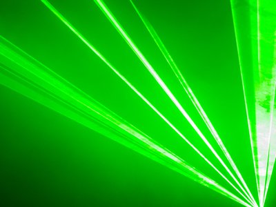 Abstract image of green laser beams