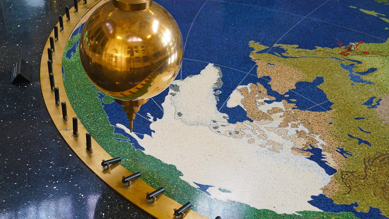 Close up of Foucault pendulum by Justin Hankins Photography