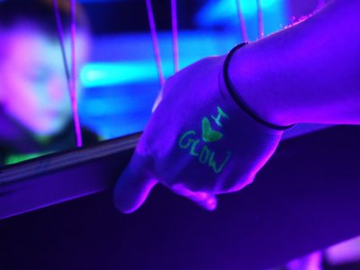 image of top of a hand with i heart glow written in black light reactive marker.jpg