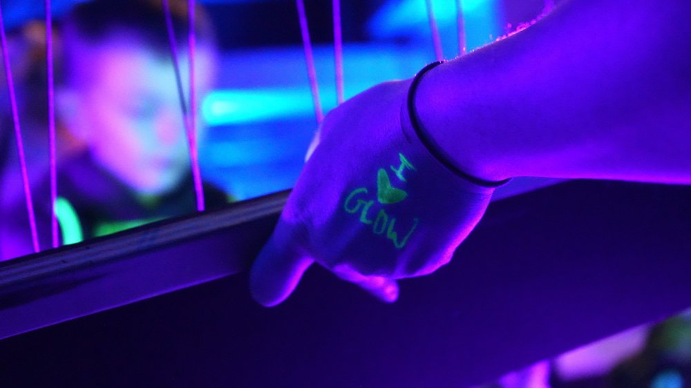 image of top of a hand with i heart glow written in black light reactive marker.jpg