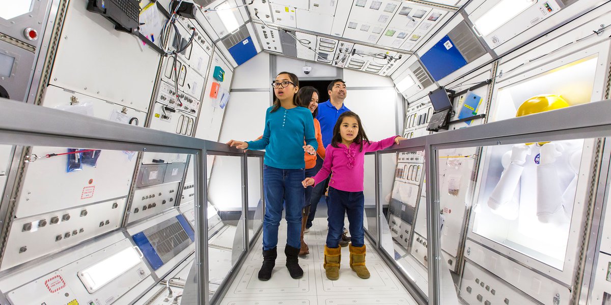 Family enjoying the Density Space Lab in the exhibition Space-An-Out-of-Gravity-Experience