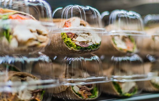 Close up picture of sandwiches in containers.