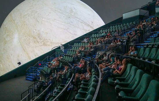 Image of audience watching moon in the Dome Theater