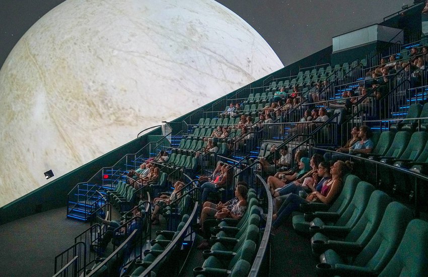 Image of audience watching moon in the Dome Theater