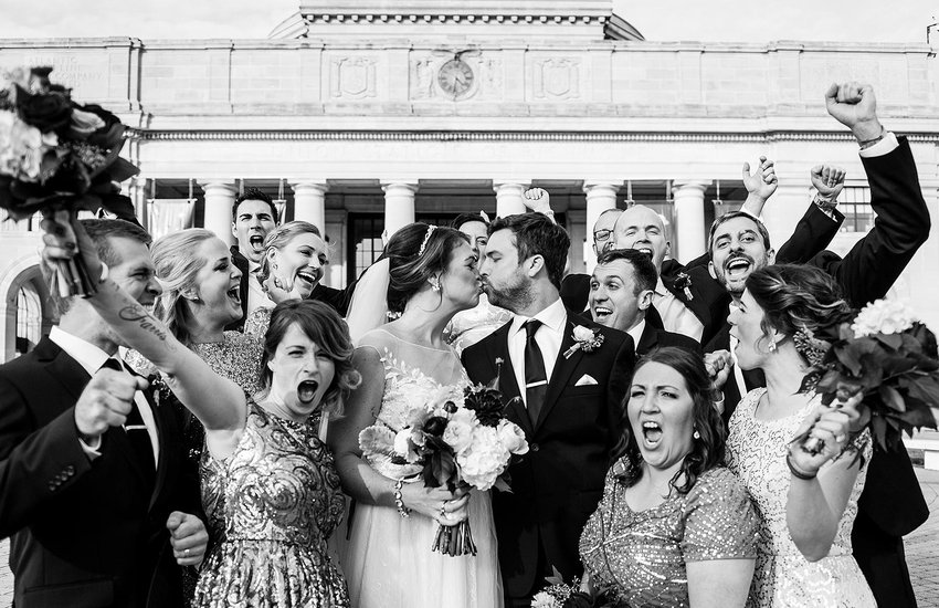Image of wedding party out front of the Science Museum by Kimie James