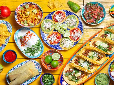 spread of colorful hispanic food and colorful plates.jpg