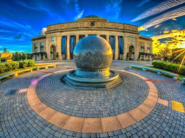 Exterior image of the Science Museum at sunset.