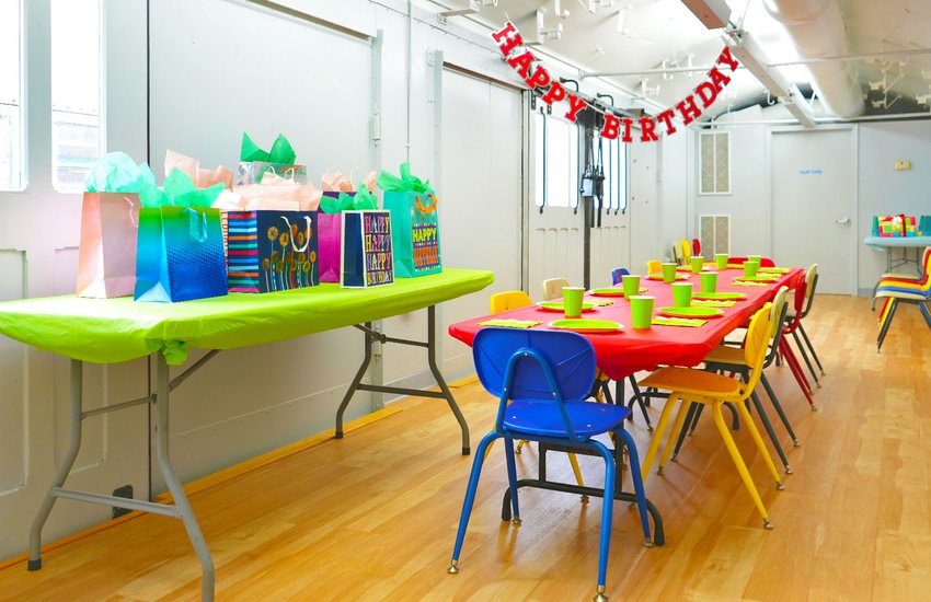 Photograph of bright colored gifts and birthday decor in WonderPlace at the Science Museum of Virginia