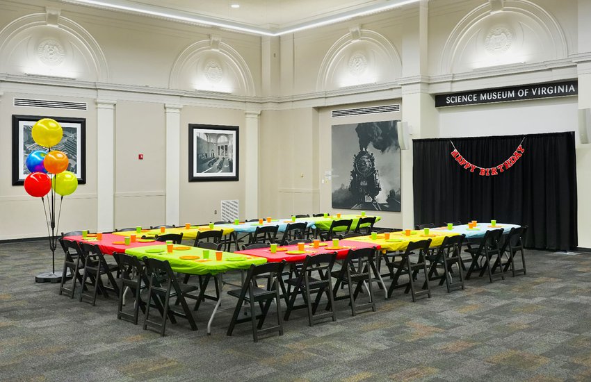 Photograph of the RF&P Forum setup with bright colored table decorations and birthday decor for a birthday party