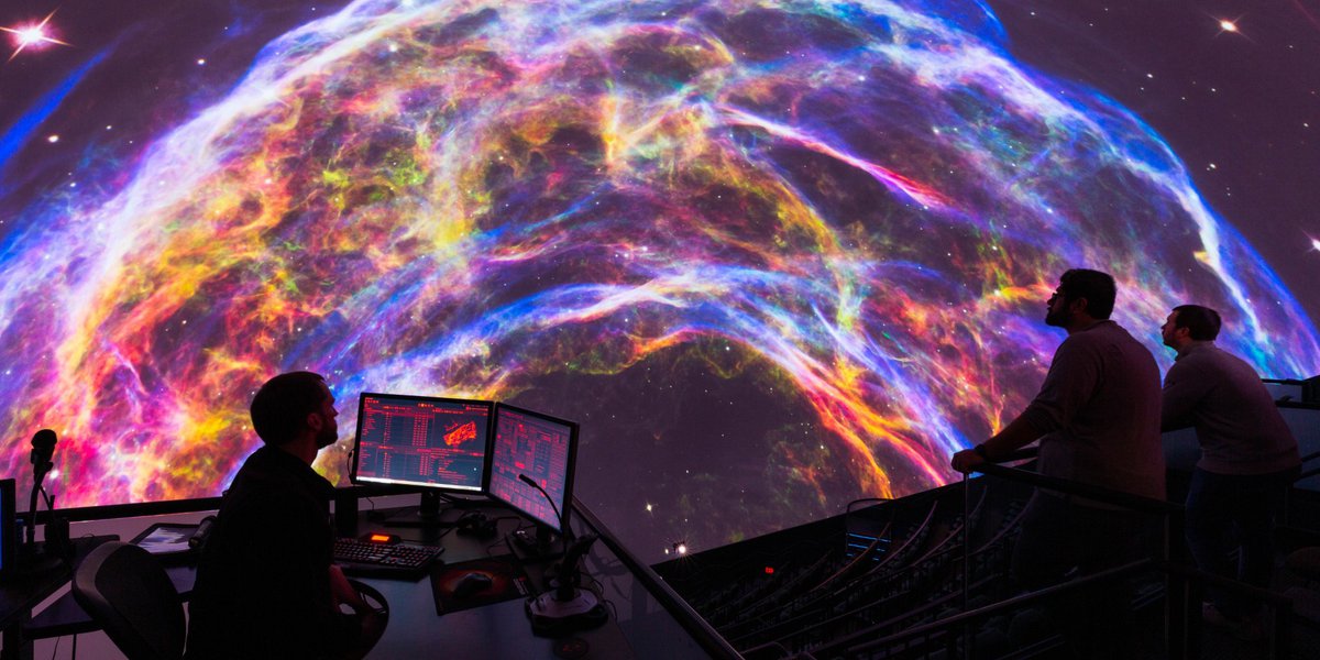 Pink, purple, orange, and blue colored space image in The Dome.
