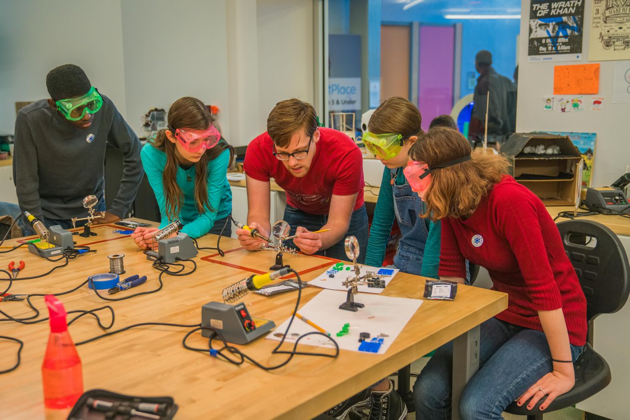 Teens working on a project in The MiX