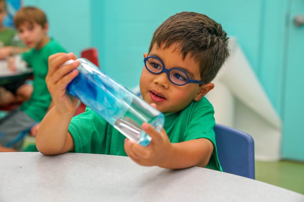 A child observing his experiment.