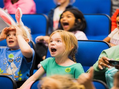 group of children observing a scientific demonstration.jpg