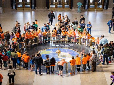 group of students observing the Foucault Pendulum.jpg