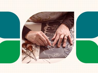 decorative: person sitting down carving a linoleum stamp