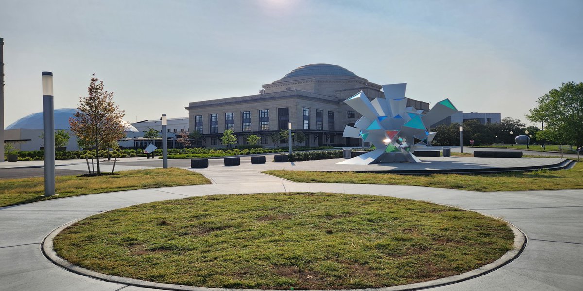 Sun rising over the Science Museum of Virginia building and the Cosmic Perception sculpture.jpg