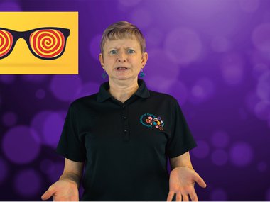 a woman with short blonde hair stands in front of a purple background, she has a concerned look on her face. In the upper left corner is a thumbnail of sunglasses with a yellow and red spiral in the lenses