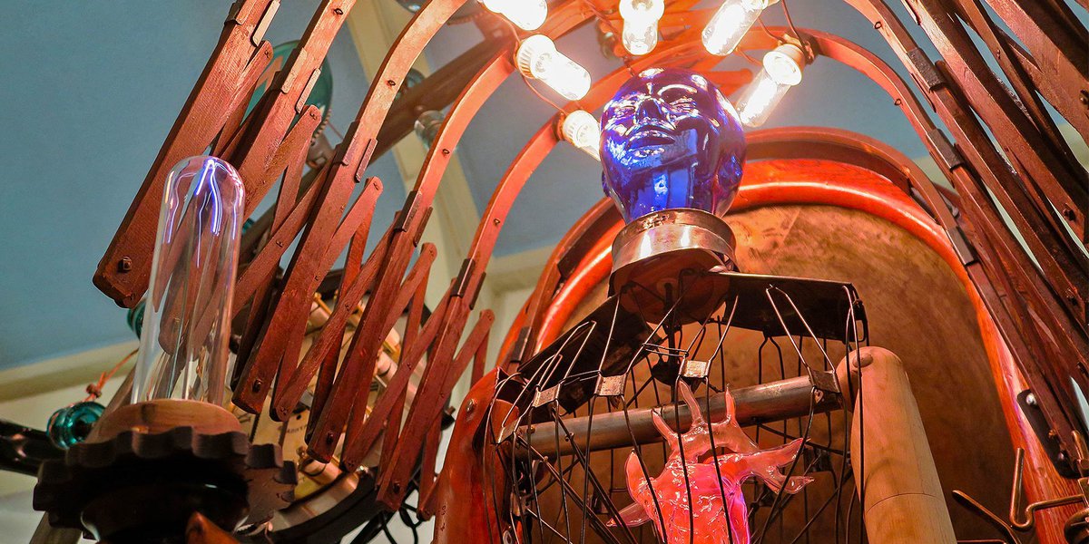 Unique sculpture in the style of steampunk with antique lights and artifacts for the exhibition Discover Steampunk