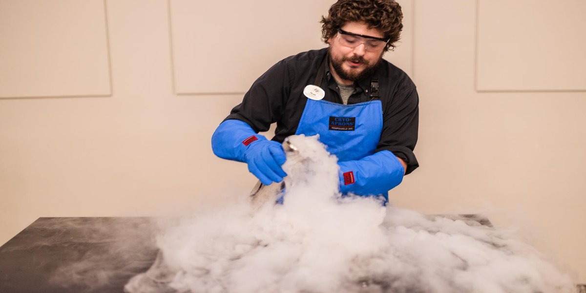 educator demonstrating chemical reaction.jpg