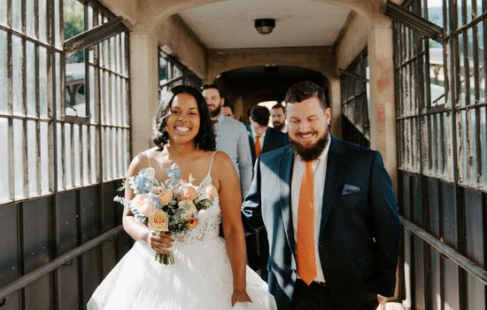 Wedding couple enter Garner Pavilion through train ramp by Amanda Arnold Photography