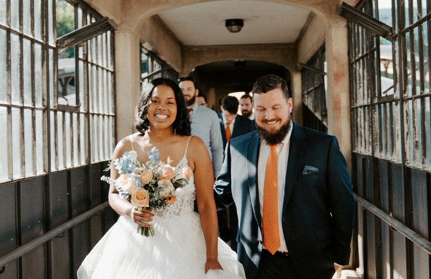 Wedding couple enter Garner Pavilion through train ramp by Amanda Arnold Photography