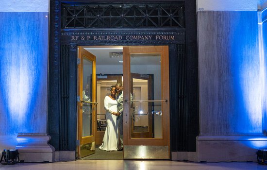 Wedding couple exiting the RF&P Forum by Josiah Mendoza