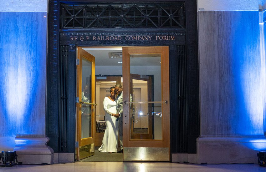 Wedding couple exiting the RF&P Forum by Josiah Mendoza
