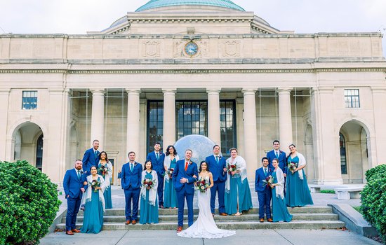 Wedding party out in front of the Science Museum by Willow Britt Studios