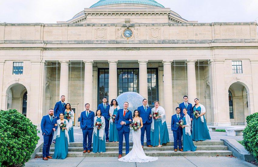 Wedding party out in front of the Science Museum by Willow Britt Studios