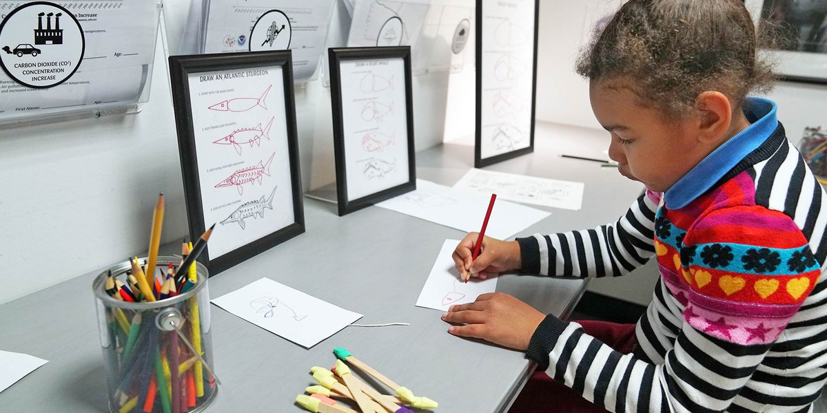 A child drawing in the Art Lab.
