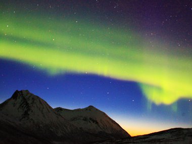 An aurora over mountains.