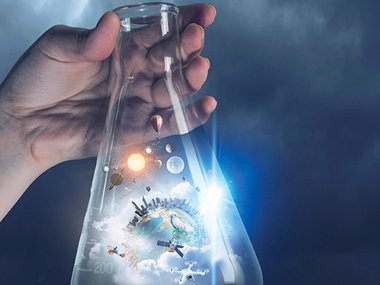 The world and solar system in a beaker.