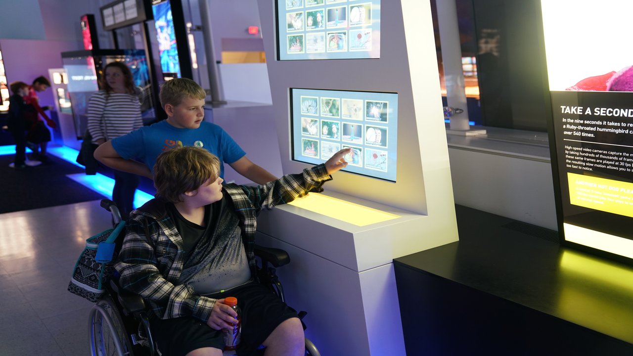 two guests engaging with an exhibit within Speed.jpg